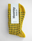 Hayes socks from Hooray Sock Co. Mid-crew length, textured ribbing, solid heel, toe, and contrasting color. In Mustard Yellow, Blue, Pink.