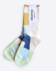 Hooray Sock Co. Lotus Crew Socks. Fun, lightweight, cozy with blue and gold lotus illustration. Crew length, 80% cotton, 20% spandex.