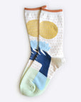 Hooray Sock Co. Lotus Crew Socks. Fun, lightweight, cozy with blue and gold lotus illustration. Crew length, 80% cotton, 20% spandex.