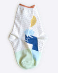 Hooray Sock Co. Lotus Crew Socks. Fun, lightweight, cozy with blue and gold lotus illustration. Crew length, 80% cotton, 20% spandex.