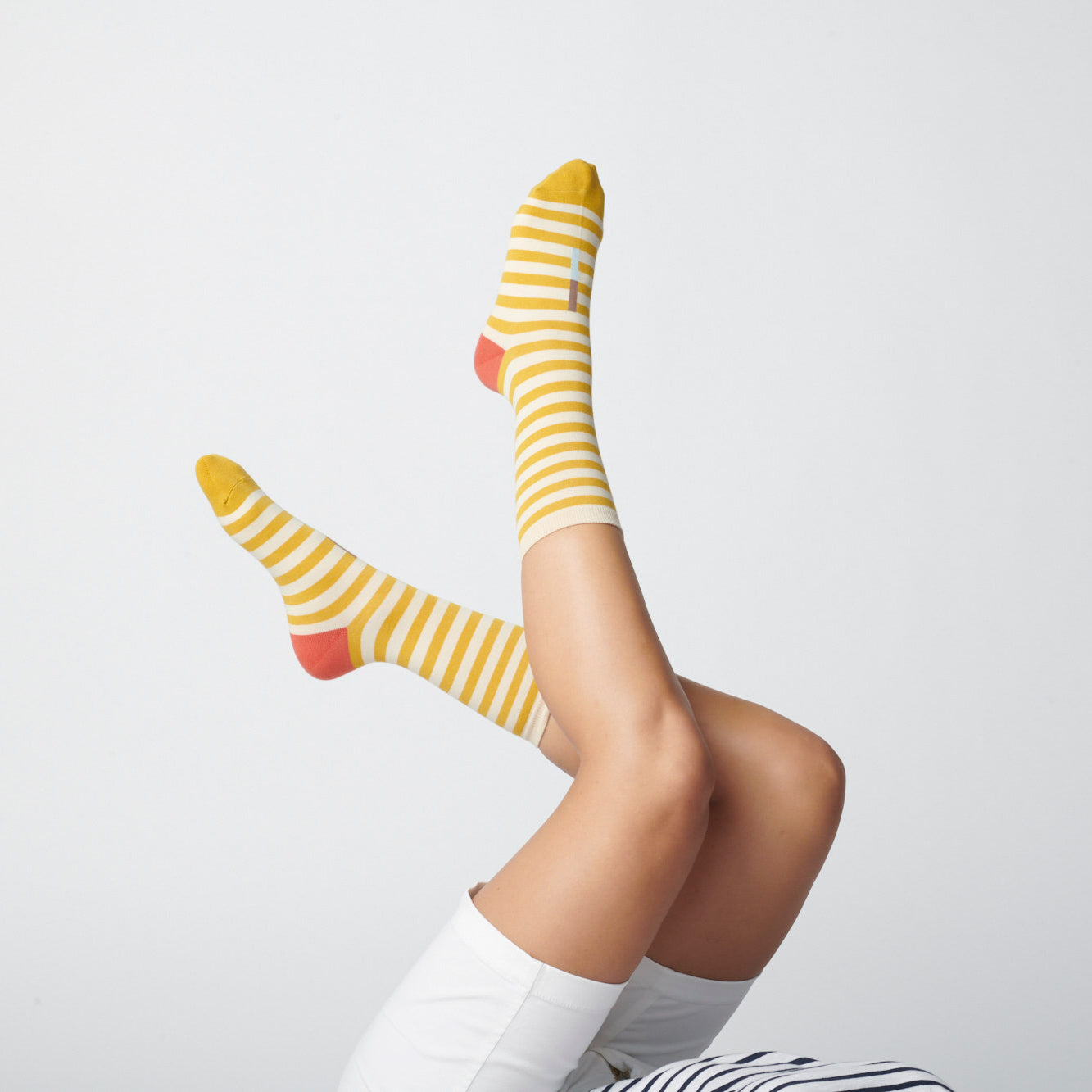 Hooray Sock Co.&#39;s Eureka Crew Socks: Best-selling, Lightweight, Comfy, Golden stripes, Hot red heels. Crew length, 80% cotton, 20% spandex. Made in South Korea. Unisex. 