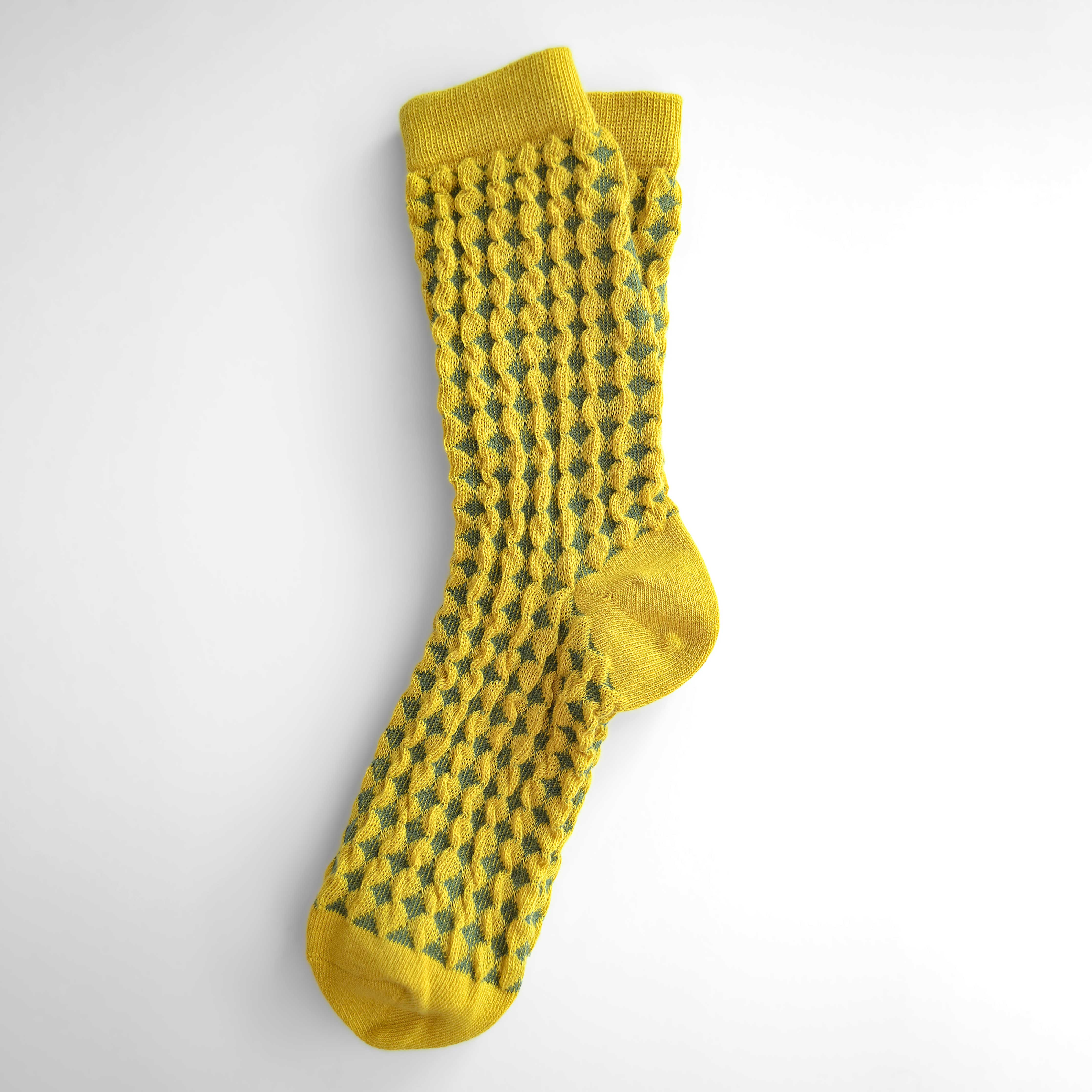 Hayes socks from Hooray Sock Co. Mid-crew length, textured ribbing, solid heel, toe, and contrasting color. In Mustard Yellow, Blue, Pink.