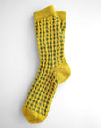 Hayes socks from Hooray Sock Co. Mid-crew length, textured ribbing, solid heel, toe, and contrasting color. In Mustard Yellow, Blue, Pink.