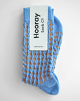 Hayes socks from Hooray Sock Co. Mid-crew length, textured ribbing, solid heel, toe, and contrasting color. In Mustard Yellow, Blue, Pink.