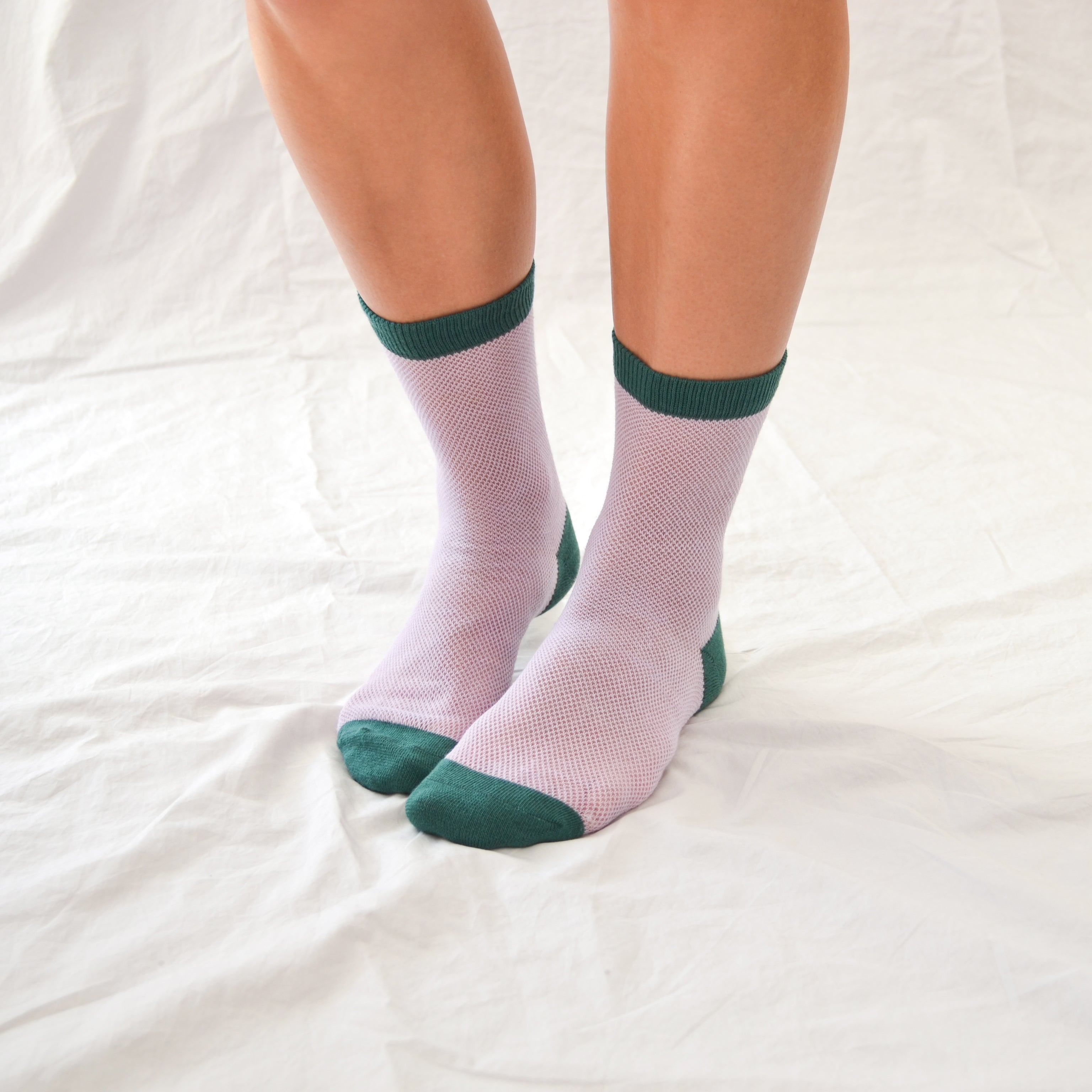 &#39;Valencia&#39; mid-crew socks, showcasing an open mesh sheer design in Cantaloupe, Pink, and Purple, effortlessly blending breathability and chic style. Size: Small (US women’s shoe size: 4-8).