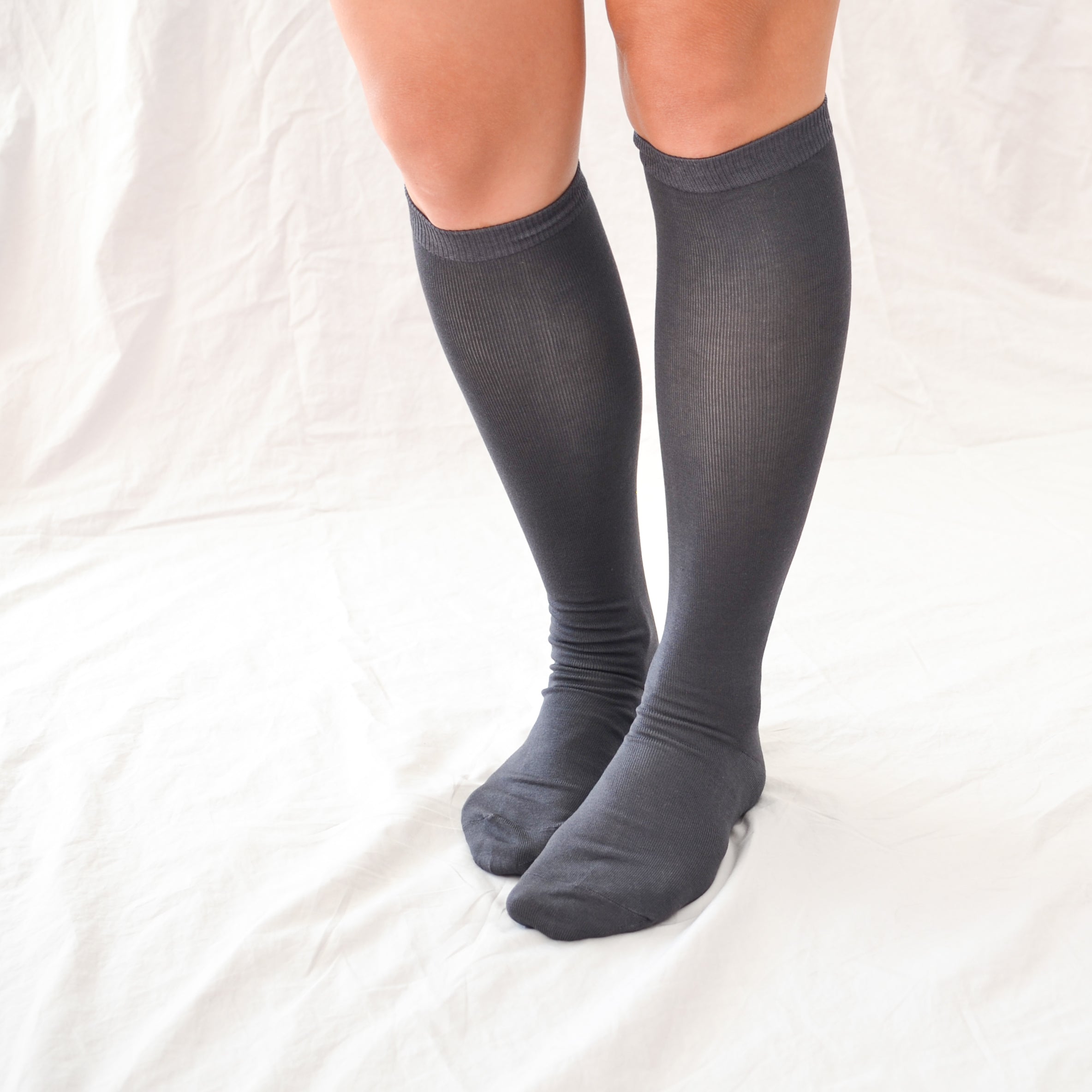 Elevate your style with our knee-high socks in classic grey, cream, and black. Luxuriously crafted for durability, these socks add a chic touch to any look. Made in South Korea. Small size (US women’s shoe size: 4-10.5)