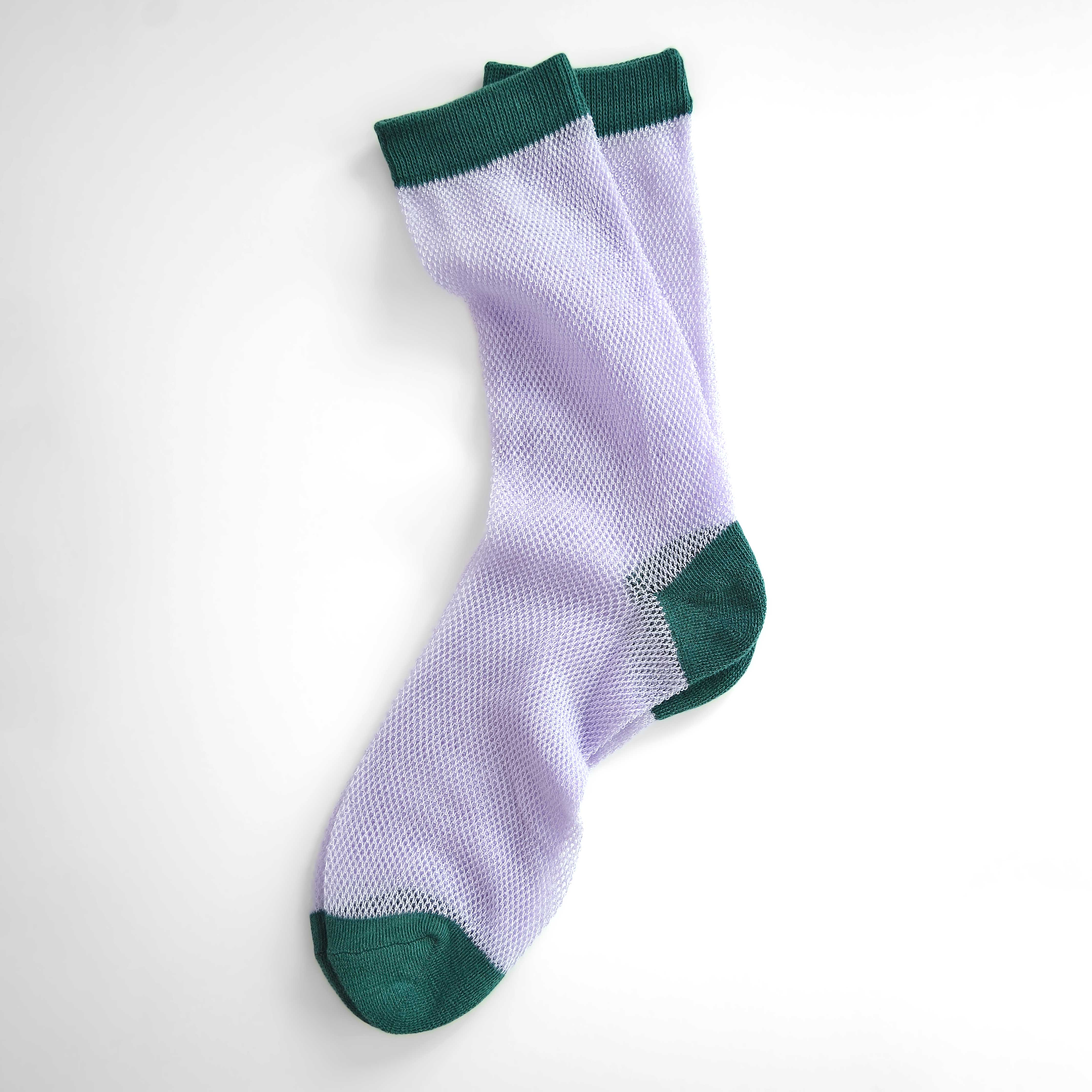 'Valencia' mid-crew socks, showcasing an open mesh sheer design in Cantaloupe, Pink, and Purple, effortlessly blending breathability and chic style. Size: Small (US women’s shoe size: 4-8)