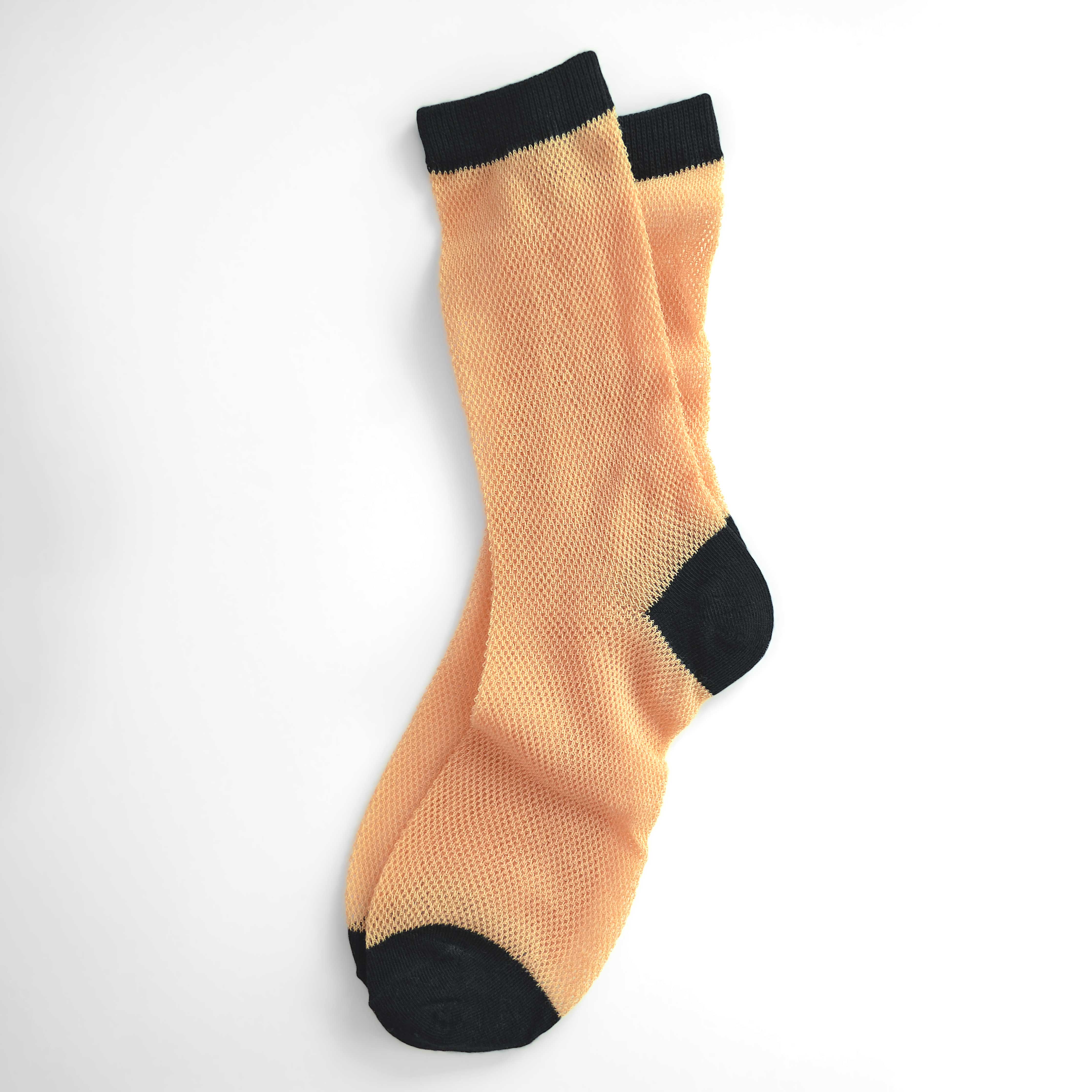 'Valencia' mid-crew socks, showcasing an open mesh sheer design in Cantaloupe, Pink, and Purple, effortlessly blending breathability and chic style. Size: Small (US women’s shoe size: 4-8).