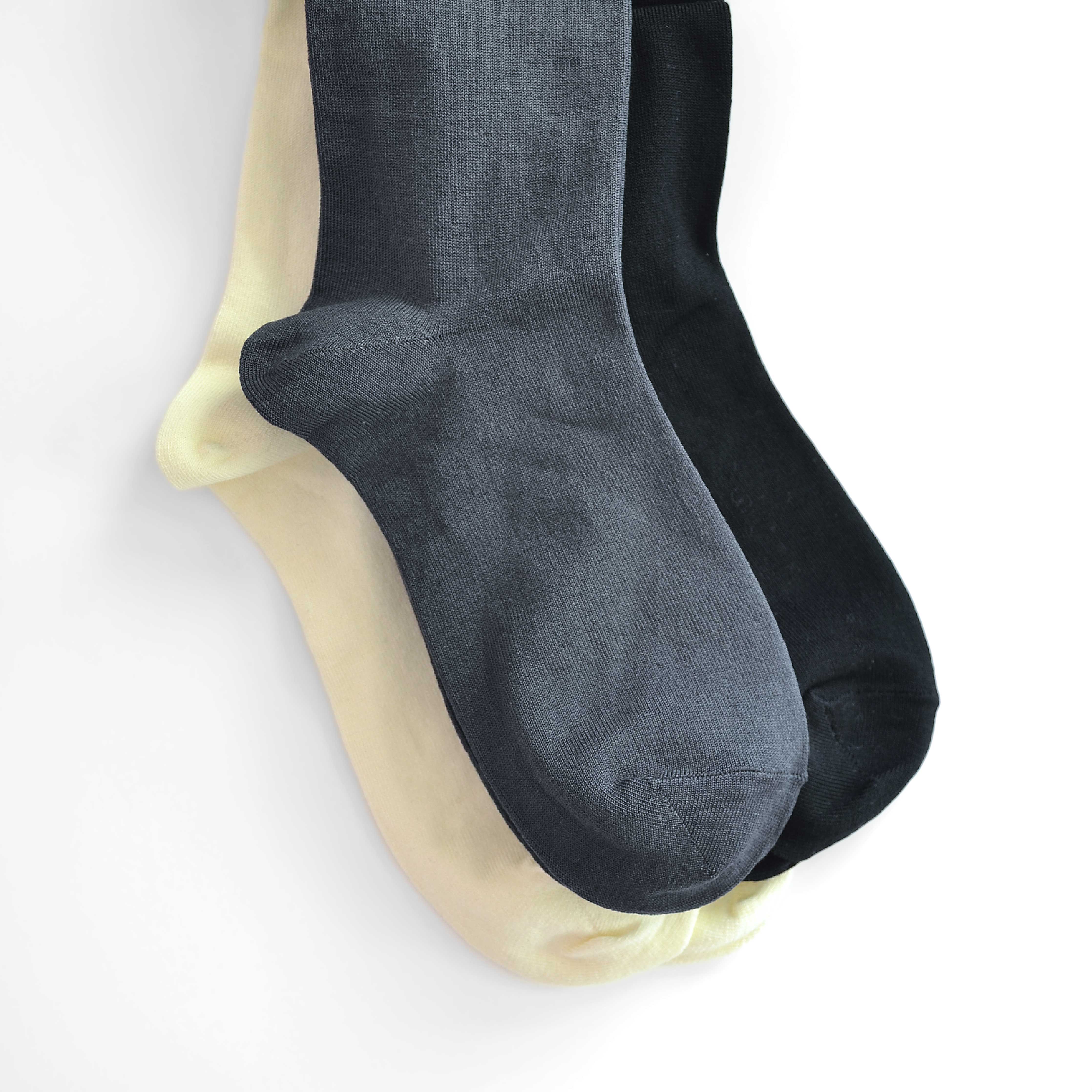 Elevate your style with our knee-high socks in classic grey, cream, and black. Luxuriously crafted for durability, these socks add a chic touch to any look. Made in South Korea. Small size (US women’s shoe size: 4-10.5)