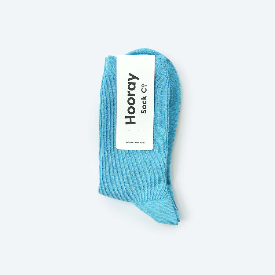 Hooray Sock Co.'s Sky Crew Socks: Everyday comfort in Sky Blue. Unisex design, shorter crew length. 80% cotton, 20% spandex. Made in South Korea. Size: Small (Women's 4-10). 