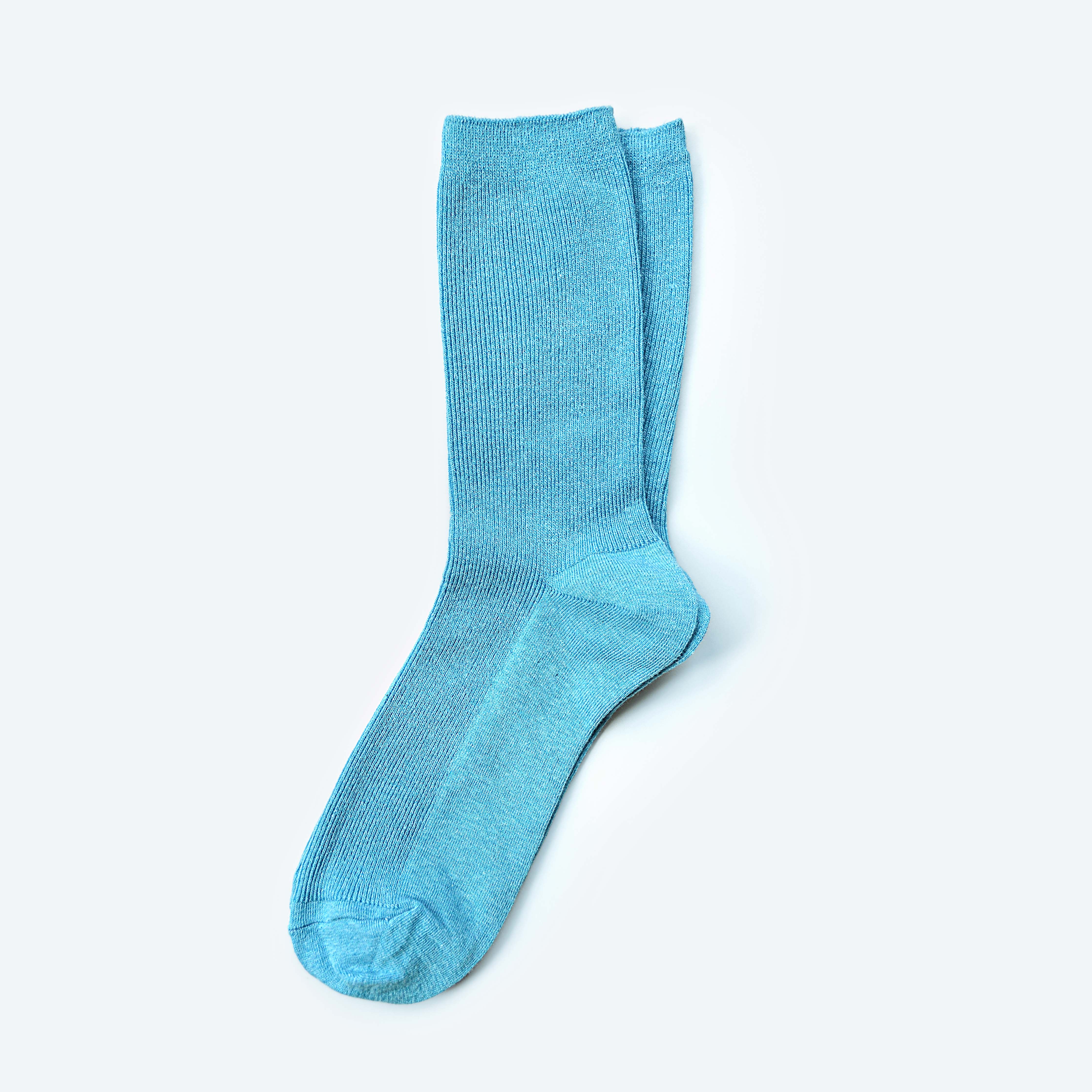 Hooray Sock Co.&#39;s Sky Crew Socks: Everyday comfort in Sky Blue. Unisex design, shorter crew length. 80% cotton, 20% spandex. Made in South Korea. Size: Small (Women&#39;s 4-10). 