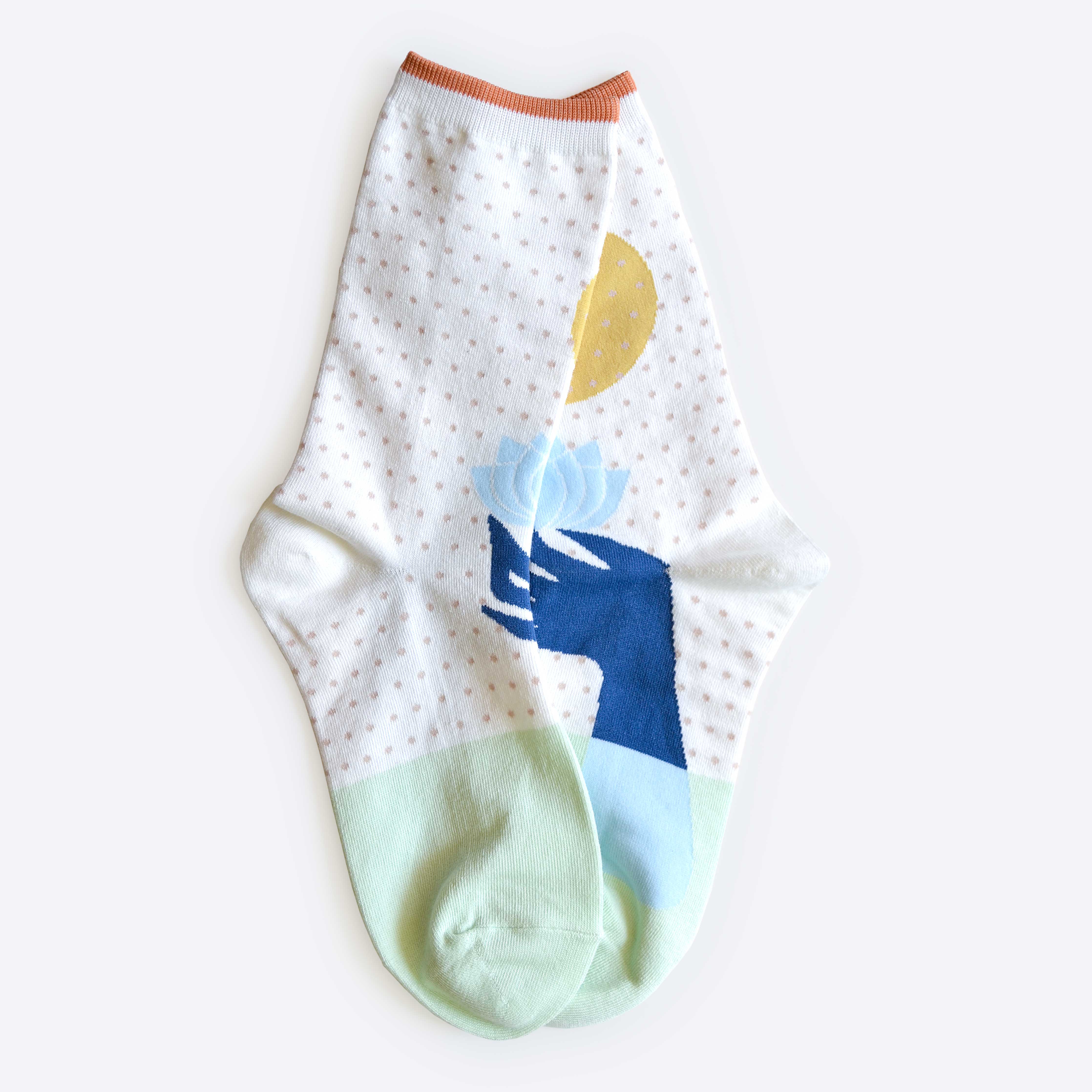 Hooray Sock Co. Lotus Crew Socks. Fun, lightweight, cozy with blue and gold lotus illustration. Crew length, 80% cotton, 20% spandex.