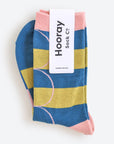 Hooray Sock Co. Polk Blue and Green Stripe Crew Socks. Groovy striped design with big circles. Crew length, 80% cotton, 20% spandex. Sizes: Large (US men’s 8-12), Small (US women's 4-10). 