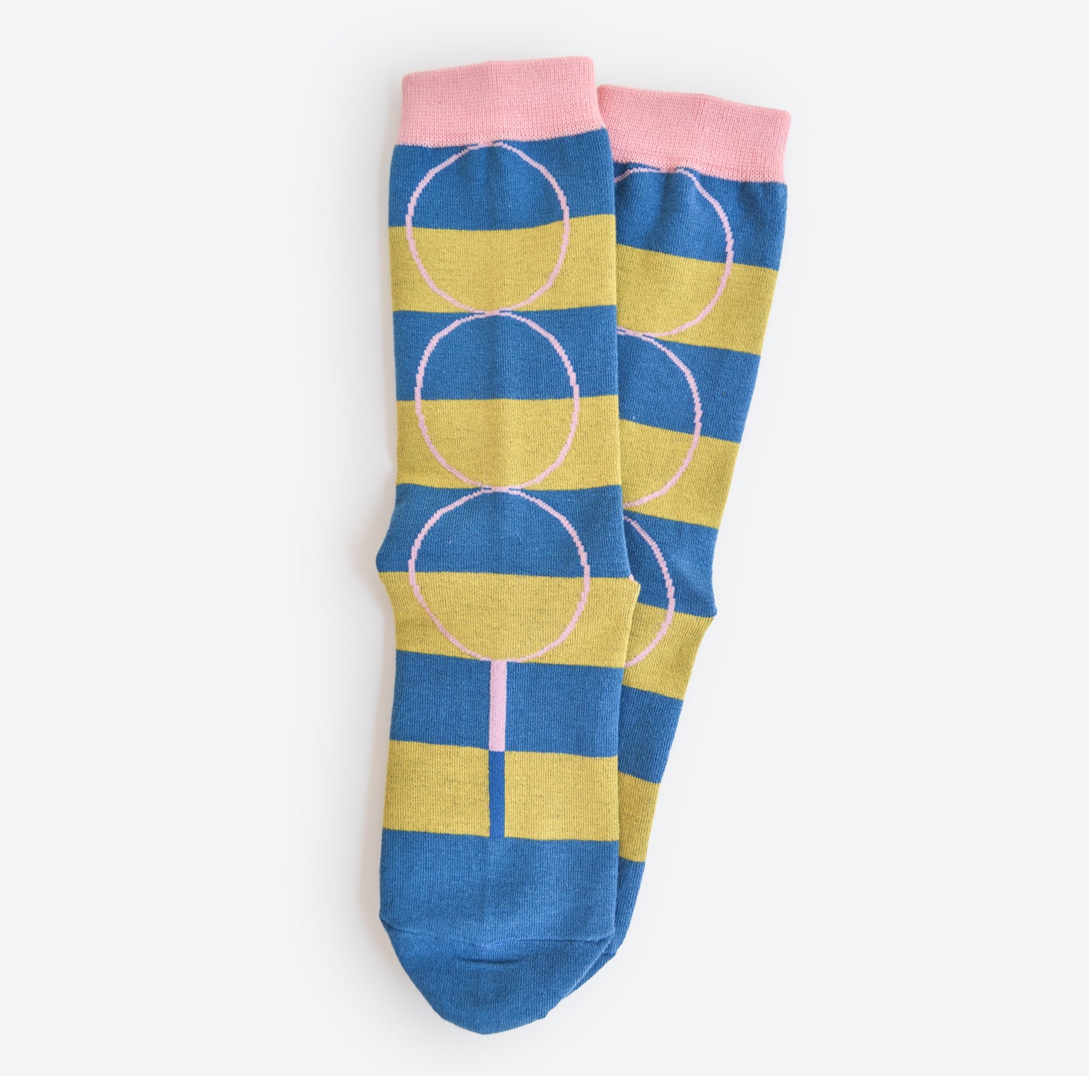 Hooray Sock Co. Polk Blue and Green Stripe Crew Socks. Groovy striped design with big circles. Crew length, 80% cotton, 20% spandex. Sizes: Large (US men’s 8-12), Small (US women's 4-10). 