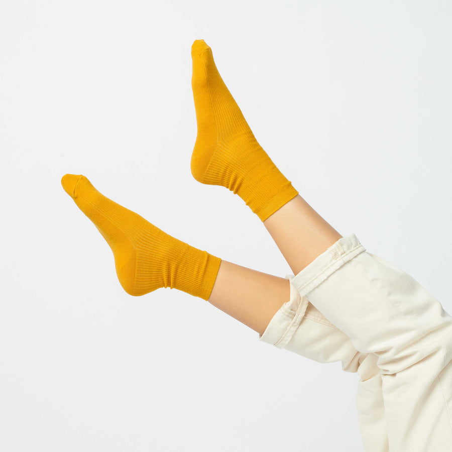 Hooray Sock Co. Gold-Hued Merino Wool Crew Socks. Cozy comfort meets fancy style. Short crew in gold hues. 20% Merino Wool.